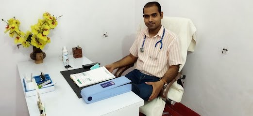 Dr. Avinash Chandra seated at his clinic desk